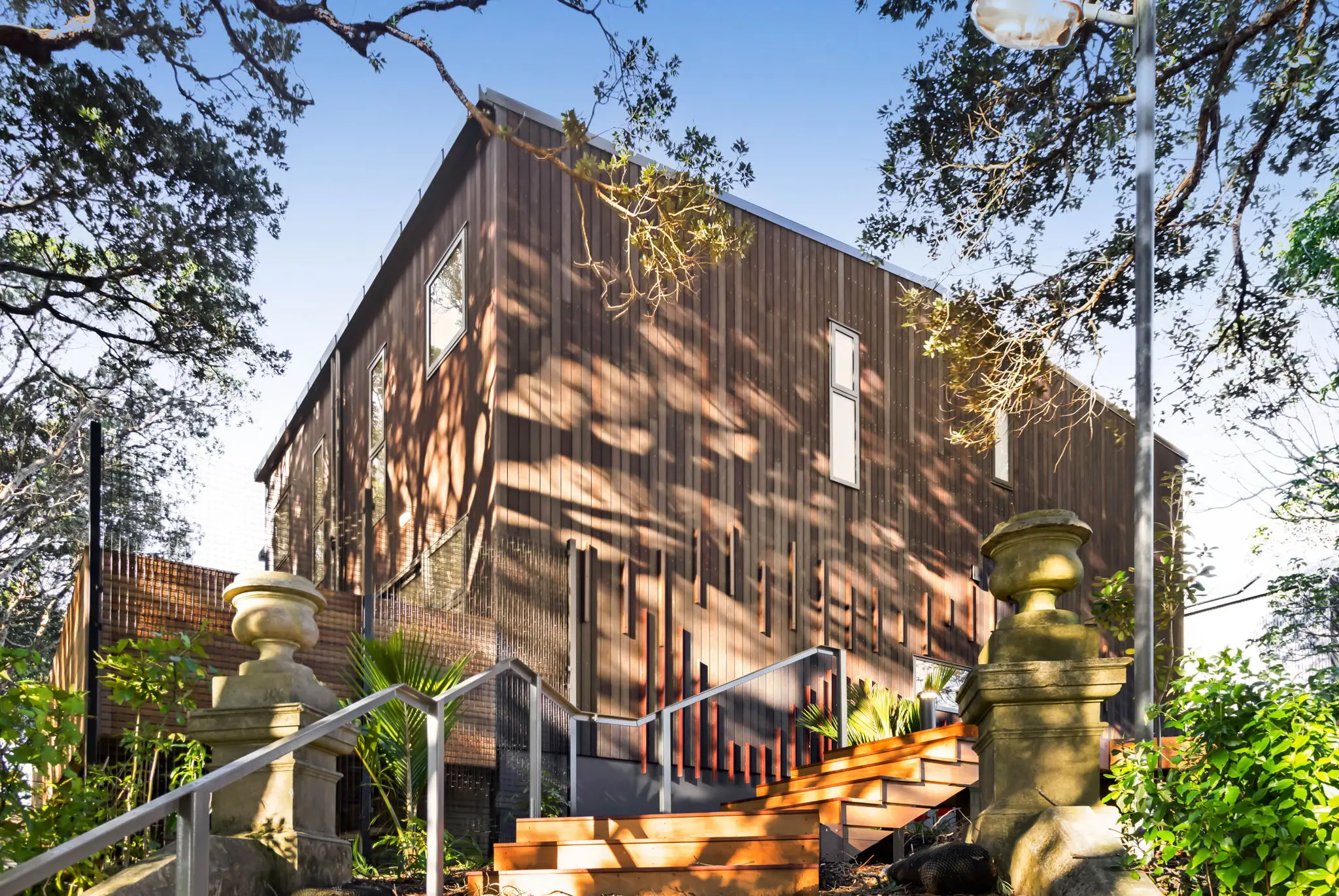 Pukekura The Parade laneway with townhouse exteriors and established plantings
